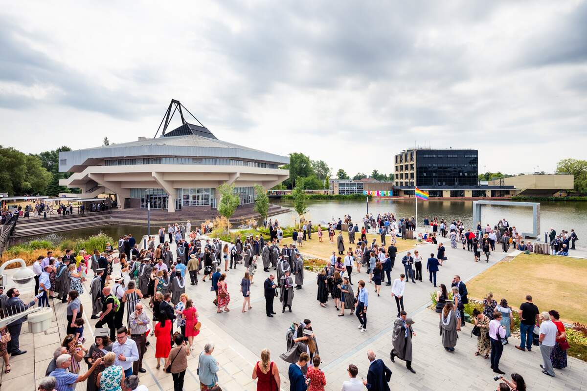 Central Hall is the distinctive centrepiece of Campus West which hosts lectures, conferences, shows and graduation ceremonies. It sits next to Greg's Place, an open-air community hub for socialising, events and summer sun which overlooks our wonderful campus lake.
